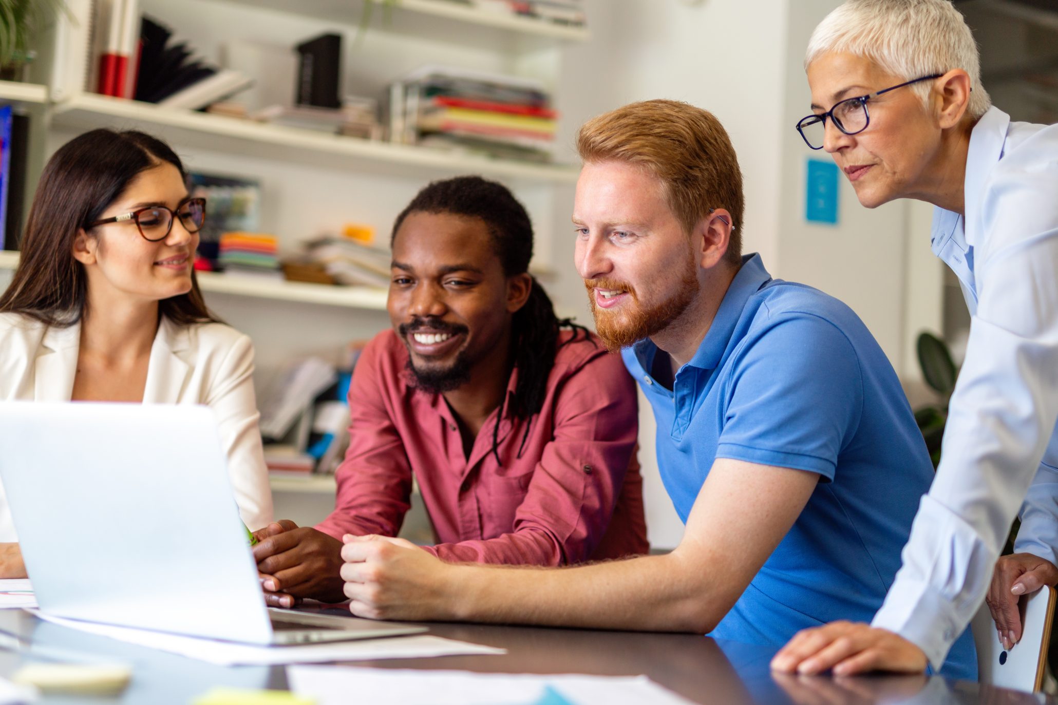 Group of happy business people working as a team at the office on meeting.